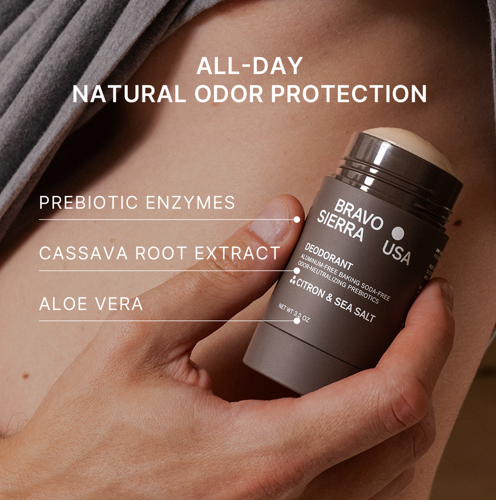 Hand holding a Bravo Sierra deodorant stick with product details on a neutral background