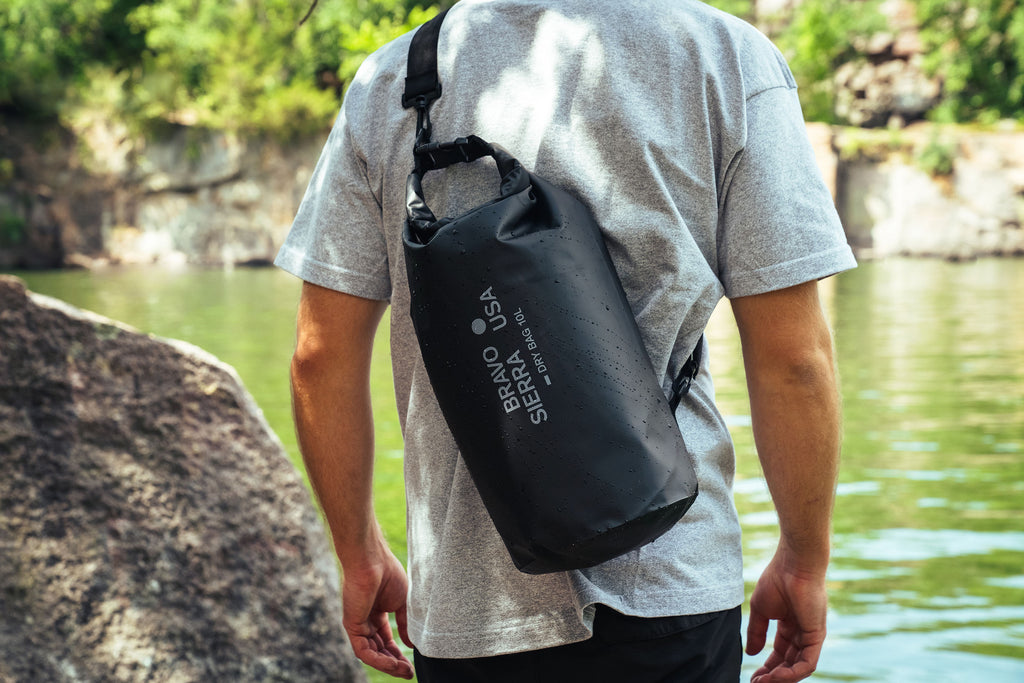 Black 10L dry bag with adjustable strap, perfect for water sports and outdoor adventures.