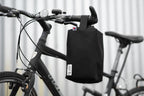 Black bike handlebar bag, durable material, perfect for cycling essentials, stylish and functional design.